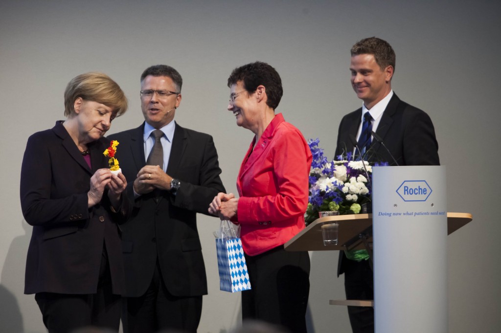 German Prime minister Angela Merkel receives a 3D printed antibody model.